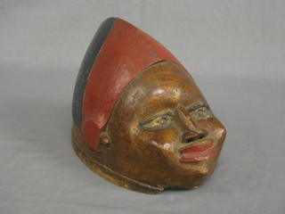 A carved African painted mask