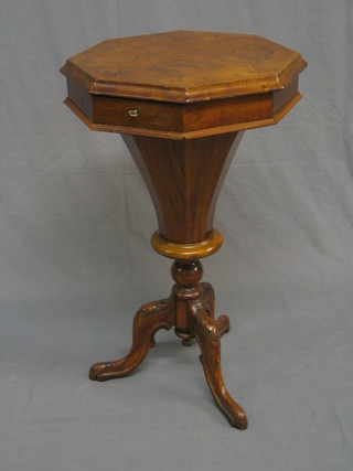 A Victorian figured walnut octagonal work table of conical form, raised on a carved tripod base 17 1/2"