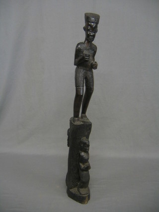 A large Eastern carved figure of a standing warrior 29"