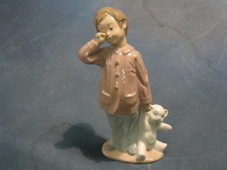 A Nao figure of a standing boy with teddy bear 6"