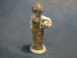 A Nao figure of a standing boy with football 7"