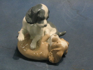 A Nao figure group of 2 puppies 6"