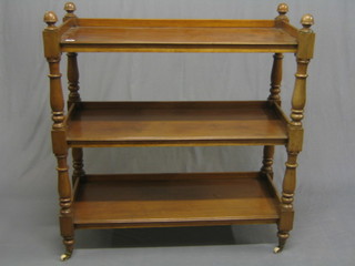 A Victorian mahogany 3 tier buffet ending in ceramic casters 40"
