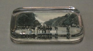 A rectangular glass paperweight the back decorated a black and white photograph of Rotton Row Carriage Drive  and another Seaside Resort