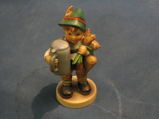 A Goebel figure of a standing boy with beerstein and parsnips (chip to base) 5"