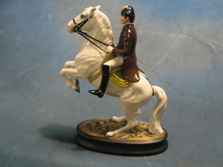 A Beswick figure of a Spanish Lipizzaner dressage horse with rider