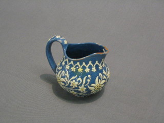 A blue glazed Art Pottery jug, base with incised marks 3"