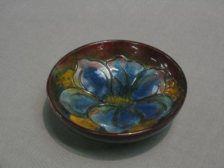 A Moorcroft Anemone pattern circular brown glazed bowl, base impressed Moorcroft Made in England E, 5 1/2"