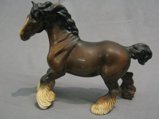 A Beswick figure of a standing shire horse with left hoof crooked, the base marked Beswick England 8"
