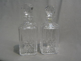 A pair of cut glass spirit decanters