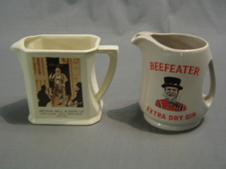 An HCW Arthur Bell Whisky water jug (chip to base) and a Wade Beefeater Gin water jug