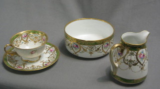 A Noritake 21 piece tea service comprising 9" bread plate, 6 tea plates 6", sugar bowl 5", cream jug 4", 6 cups and saucers, 1 cup with slight chip to trim and some rubbing to the gilding, with 1908 Noritake mark