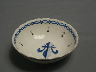 A circular Quimper blue and white bowl decorated Fleur de Lis, the base monogrammed HB, 8"