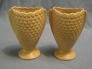 A pair of Sylvac brown glazed twin handled vases with feather decoration, raised on circular bases 9"