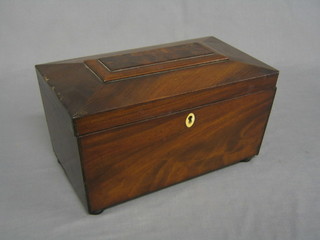 A 19th Century mahogany twin compartment tea caddy of sarcophagus form with hinged lid and ivory escutcheon, raised on bun feet 12"