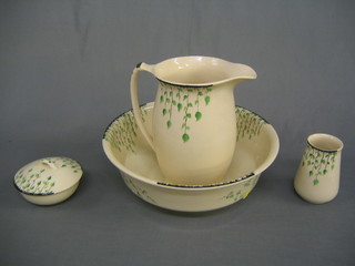 A Hampton Ivory pattern wash bowl, jug, tooth brush pot and soap dish all with stylised leaf decoration