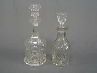 2 mallet shaped glass decanters and stoppers (1 stopper f)