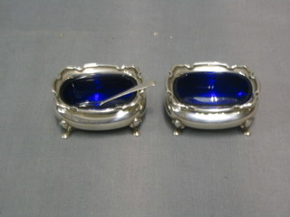 A pair of Georgian style silver salts with glass liners