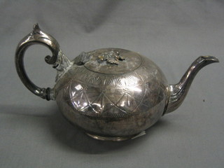 An engraved Britannia metal teapot