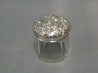 An Edwardian circular cut glass dressing table jar with embossed silver lid, Birmingham 1905 3"