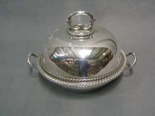 A circular silver plated twin handled muffin dish and cover with gadrooned border (slight dent to lid) by Mappin & Webb