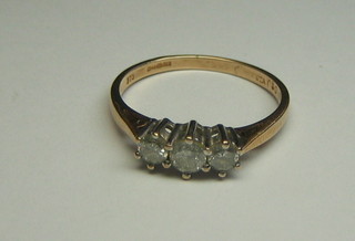 A lady's gold dress ring set 3 diamonds
