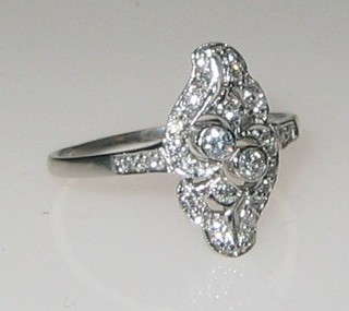 An 18ct white gold marquise shaped dress ring set 2 diamonds and numerous other diamonds