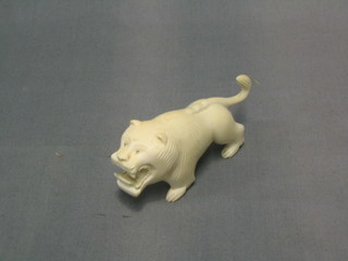 An ivory figure of a walking lion 3"