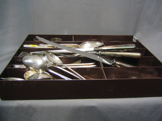 A collection of silver plated flatware