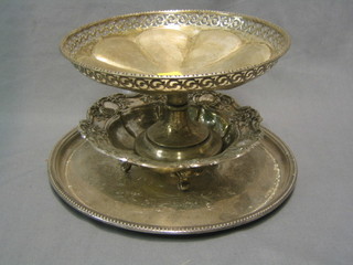 A circular embossed silver plated bowl raised on 4 feet 7", a circular pierced silver plated fruit bowl 8" and a silver plated salver 10"