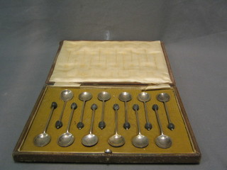 A set of 12 silver bean end coffee spoons, Birmingham 1918, cased