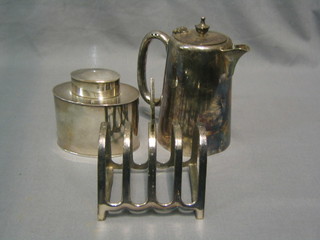 An oval silver plated caddy 3", a 5 bar silver plated toast rack and a silver plated hotelware hotwater jug