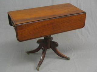 A Georgian mahogany pedestal Pembroke table, fitted a frieze drawer and raised on pillar and tripod supports ending in brass paw feet and castors 36"