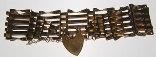 A 9ct gold gate bracelet with heart shaped padlock clasp