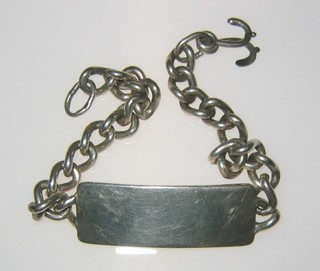 A silver curb link identity bracelet