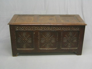 A  17th/18th Century carved oak coffer of panelled construction with hinged lid 15"