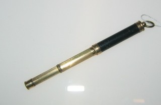 A miniature gilt metal propelling pencil and a tortoiseshell paper knife
