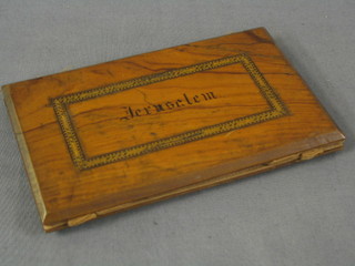 An olive wood wallet, marked Jerusalem, 5"