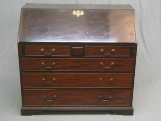A Georgian mahogany bureau, the fall front revealing a well fitted interior above 2 short and 3 long graduated drawers raised on bracket feet with brass swan neck drop handles 42"