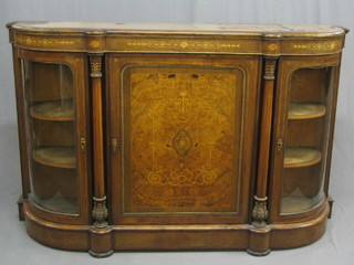A handsome Victorian inlaid figured walnut credenza with gilt metal mounts throughout, the centre door inlaid satinwood stringing flanked by a pair of arch shaped doors 65"