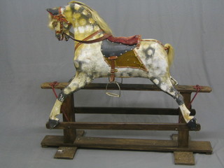 A 19th/20th Century dapple grey rocking horse (requires attention)