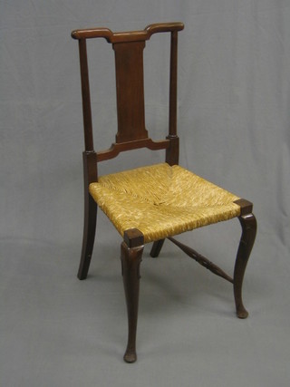 A Queen Anne style walnut splat back bedroom chair with woven cane seat, raised on cabriole supports
