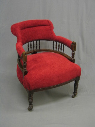 A Victorian rosewood tub back chair with bobbin turned decoration