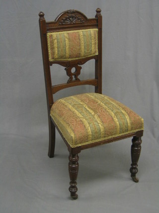 An Edwardian oak high back chair