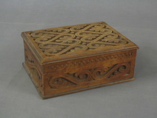 An Eastern carved hardwood box with hinged lid 11"