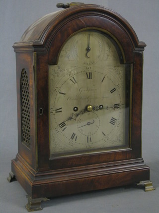 A Georgian striking fusee bracket clock, the 7" arch shaped silvered dial with strike silent indicator, the dial signed George Tupman of Grosvenor Square (dial with 5 modern visible brass screws), contained in an arch shaped mahogany case (split to top) and with pierced oval grills to the side, raised on gilt bracket feet, the 5 1/2" brass back plate engraved a 1/2" border with G T monogram to the centre and having a 3" circular pendulum bob  slightly engraved, together with an associated wooden bracket