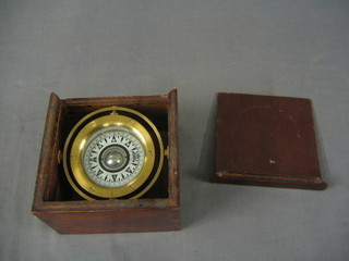 A brass and plastic cased compass marked Sailing CP 55/75