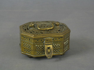 An Eastern pierced brass lozenge shaped trinket box with hinged lid 6"