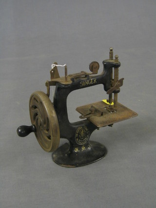 A childs Singer sewing machine