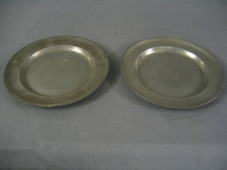 A pair of 18th Century circular pewter plates with London Tudor Rose and Britannia touch marks to the base 20"